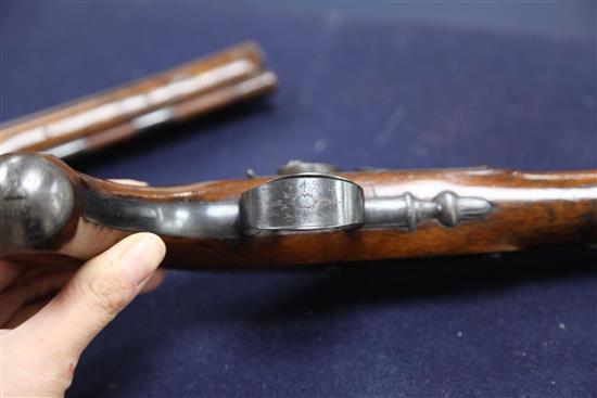 A pair of early 19th century percussion lock pistols, by Wogdon of London, 14in.